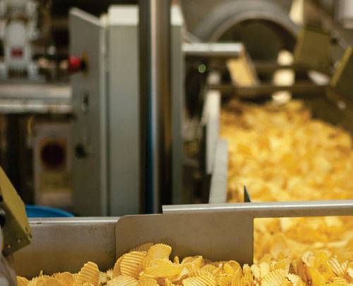 Extrusion technology to produce spicy chips